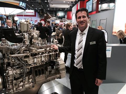Geoff Stigler, of John Deere, with the company's latest series of engines released at Intermat, Pari
